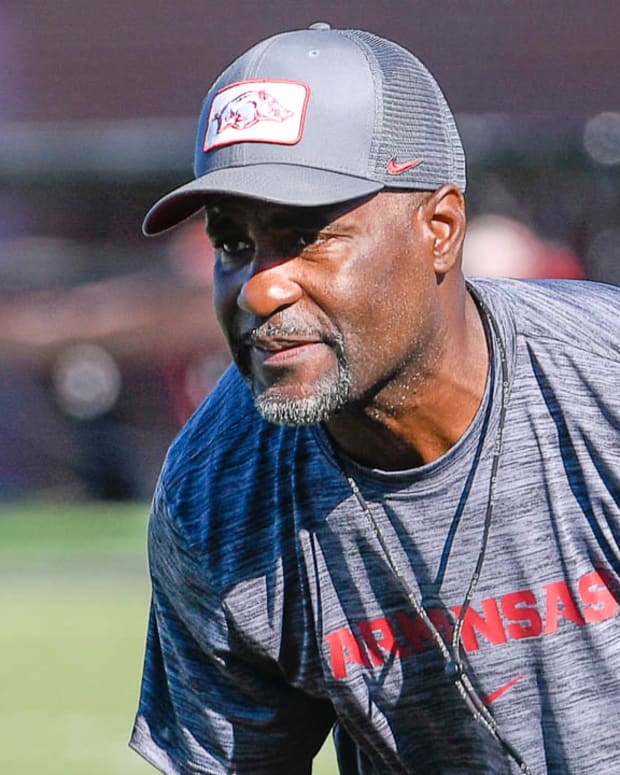 Razorbacks' defensive secondary coach Marcus Woodson on the outdoor turf field Wednesday morning